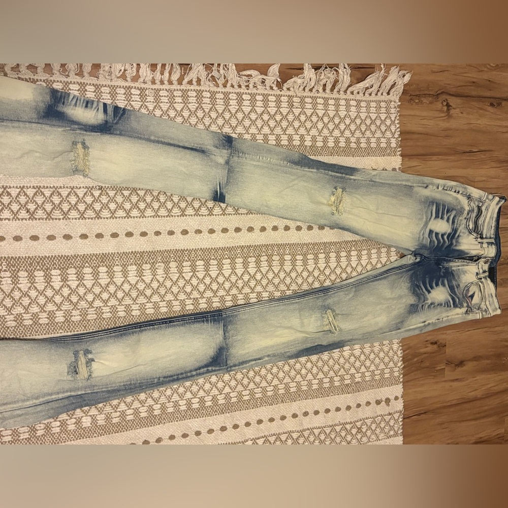 Blue and white distressed denim jeans